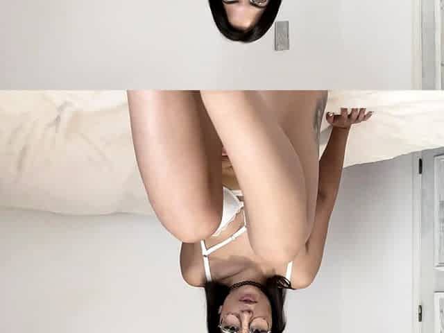 Small titted brunette Sharron with glasses masturbates