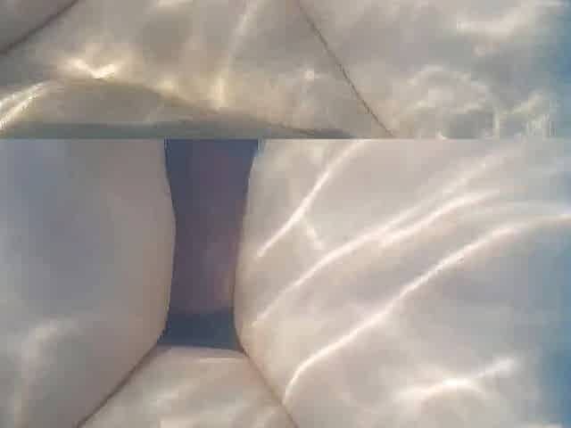 Playful sissy hiding face behind stuffed teddy bear