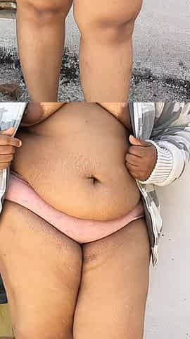 India Curvy Girl in White Jacket Strips for the Camera