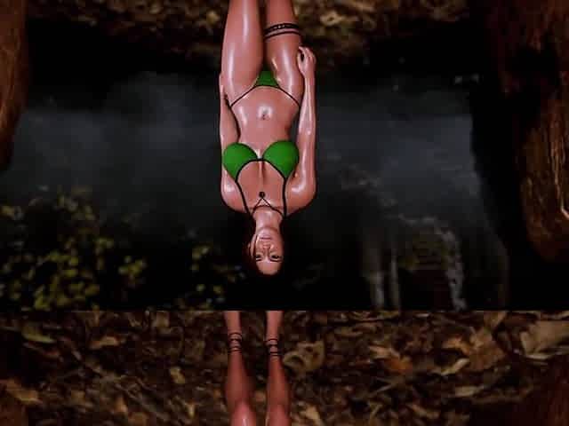 Aged hot Lara Croft alone seductively posing in microbikini at thicket