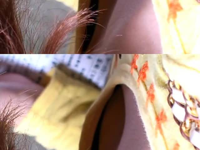 Chubby redhead Japanese shows her cleavage on candid cam video