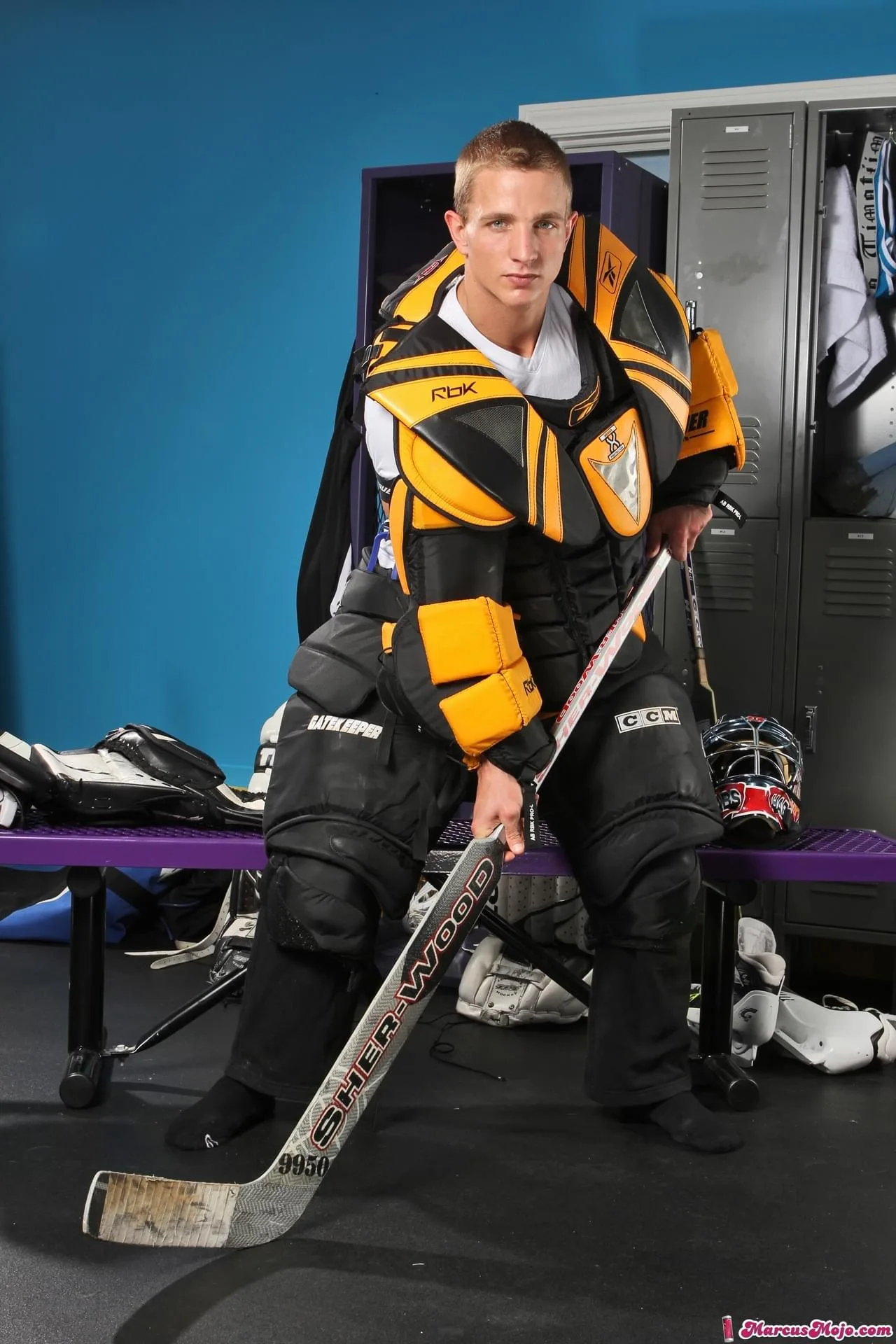 Two college hockey teammates enjoy a private post-practice hookup in the locker room