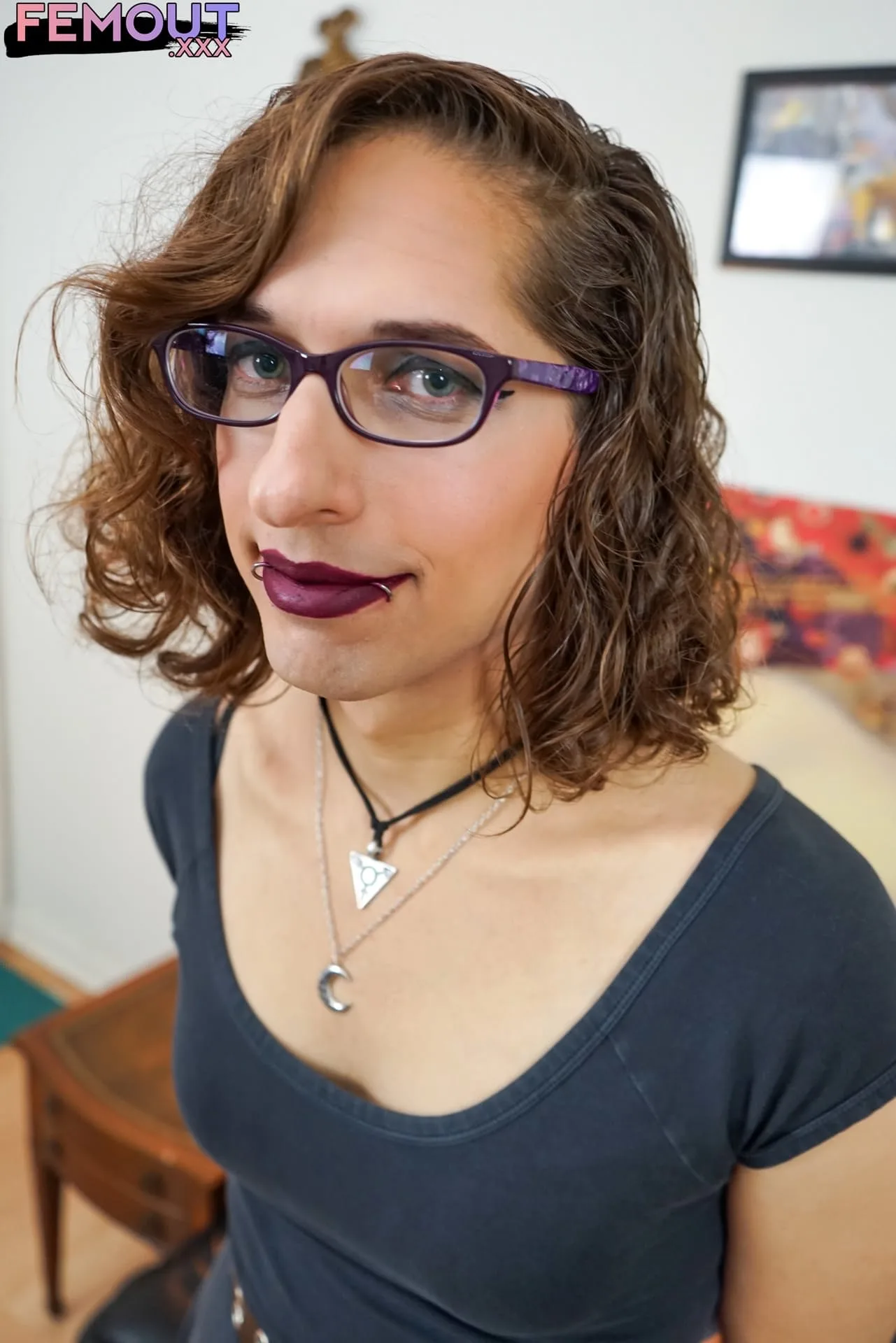 Trans girl with red lips and curly hair inserts a butt plug while masturbating — Spotlight
